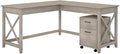Bush Furniture File Cabinet can roll Underneath The L Desk and Features Front-Locking casters for Secure Placement