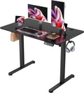 Furmax Electric Standing Desk, 40 x 24 Inches Sit Stand up Desk, Sit Stand Height Adjustable Home Office Desk with 4 Height Position Memory - with Splice Board (Black, 40)
