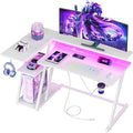Korfile 40 Inch Gaming Desk with Power Outlet & LED Lights, L Shaped Computer Gaming Table with 3 Tiers Storage Shelves, Corner Gamer Desk with Monitor Stand for Small Space, Carbon Fiber White