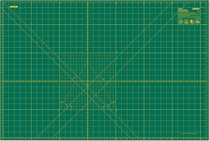 OLFA 24" x 36" Self Healing Rotary Cutting Mat (RM-MG) - Double Sided 24x36 Inch Cutting Mat with Grid for Quilting, Sewing, Fabric, & Crafts, Designed for Use with Rotary Cutters (Green)