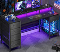 Korfile 55 Inch Gaming Desk with Power Outlets and LED Lights, Reversible Computer Desk with 5 Fabric Storage Drawers, Home Office Desk with Monitor Stand for Working Writing Study, Carbon Fiber Black