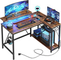 Bestier Gaming Desk with Power Outlets, 42" L-Shaped Gaming Desk with LED Lights, Desk with Reversible Storage Shelves & Hooks for Small Spaces, Bedrooms & Offices,Rustic Brown
